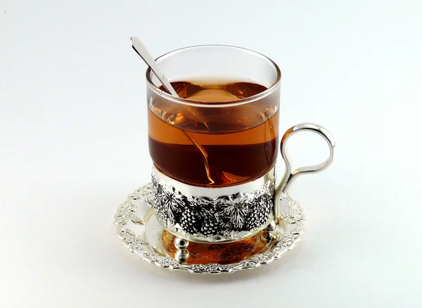 Chá em caneca de vidro e limões — Fotografia de Stock
