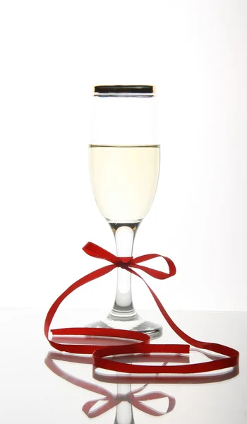 Wineglass with red bow — Stock Photo, Image
