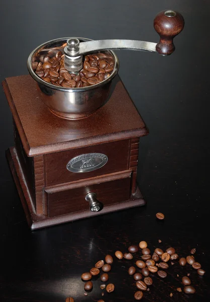 Coffee grinder on black — Stock Photo, Image