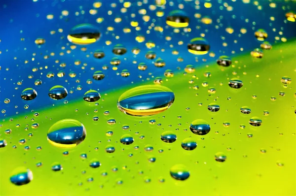 stock image Colorful rain drops on the glass