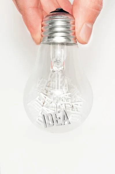 Hand with light bulb full of ideas — Stock Photo, Image