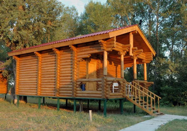 The wooden house with a porch. — Stock Image The wooden house with a porch. Royalty Free Stock Images