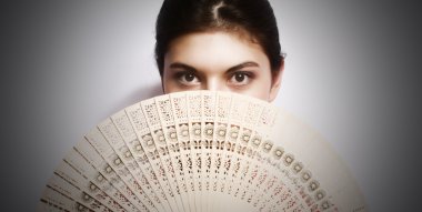 Portrait of the girl with a fan. clipart
