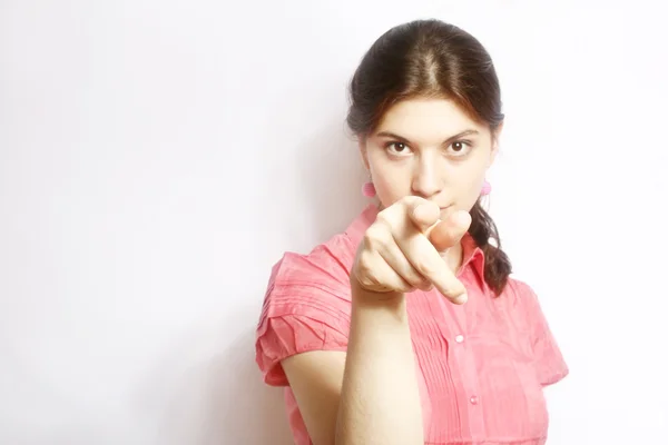Retrato da menina, mostrando um dedo . — Fotografia de Stock