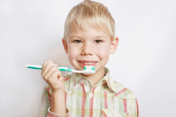 Portrait of the boy cleaning teeth. — Stock Photo, Image