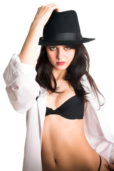 Fiatal lány fekete kalapban — Stock Fotó