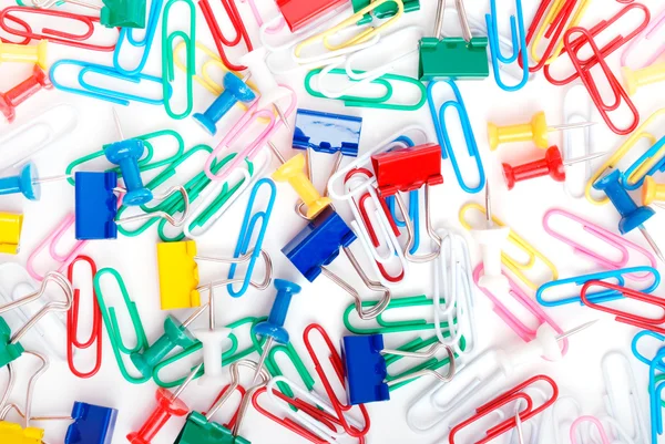 stock image Multicolored paper clips and thumbtacks