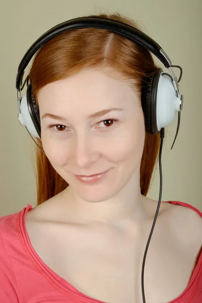 Woman in headphones — Stock Photo, Image