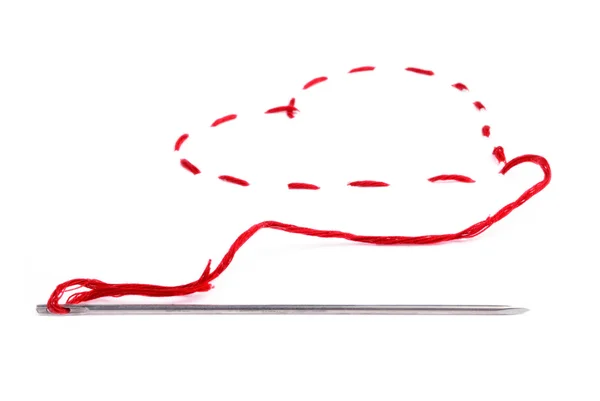 stock image Needle with a red thread. Heart