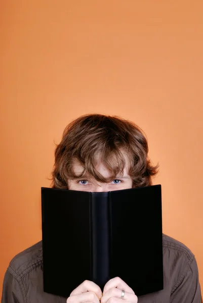 stock image Man looking over the book