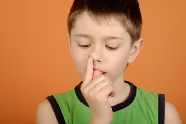 Boy is picked in a nose clipart