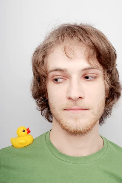 Young man with a duck — Stock Photo, Image