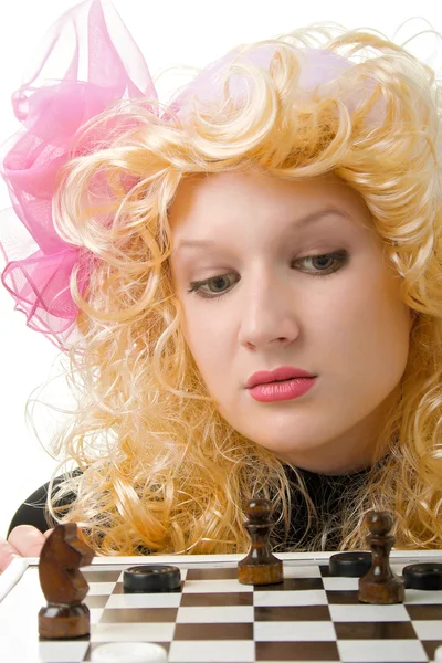 Blonde met een roze boog in spel — Stockfoto