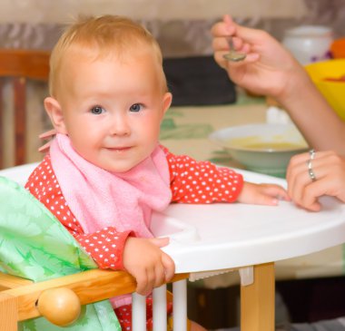 Feeding of the child clipart