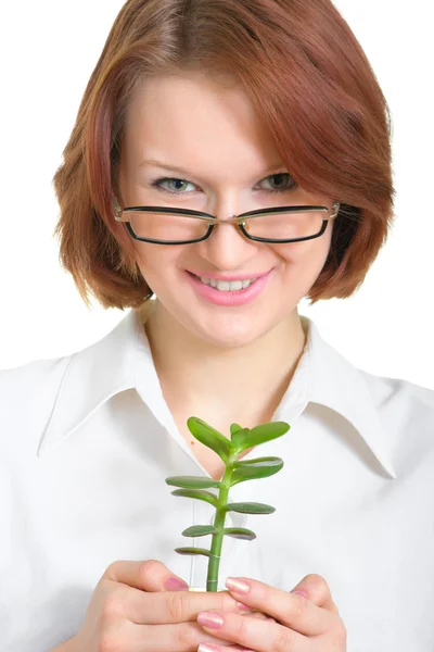 Menina em óculos com uma planta — Fotografia de Stock