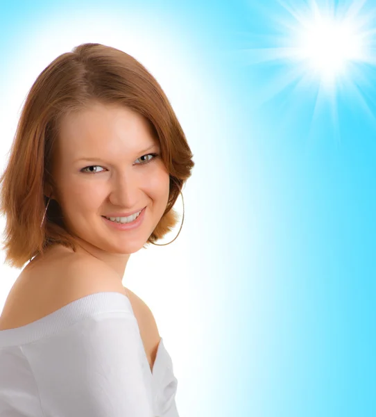 Smiling girl on a blue background — Stock Photo, Image