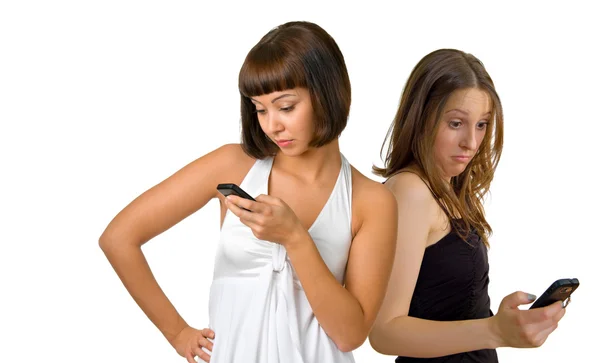 Mulheres bonitas com os telefones — Fotografia de Stock
