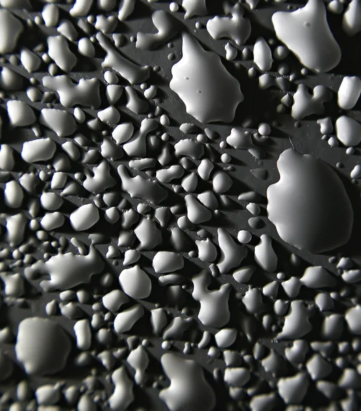 Gotas de agua en superficie blanca — Foto de Stock