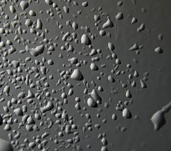 Gotas de agua en superficie — Foto de Stock