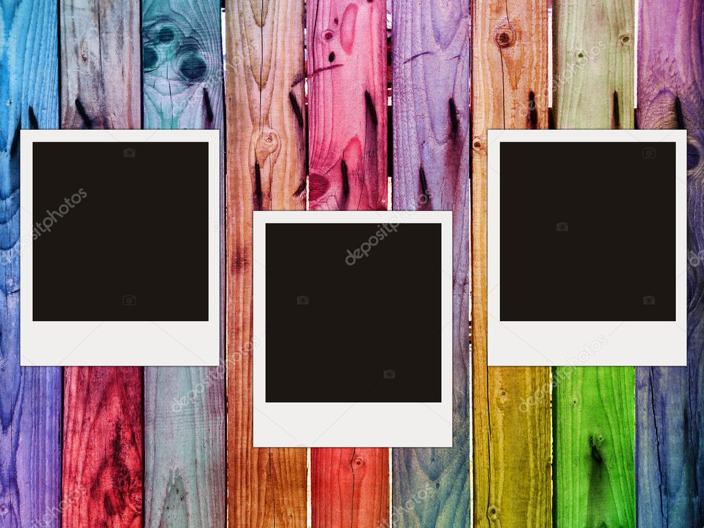 Colorful wooden fence with three blank p