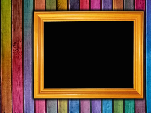 Colorful wooden wall with a frame — Stock Photo, Image