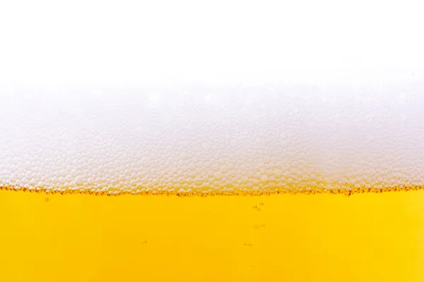 Cerveja com um fundo bolhas — Fotografia de Stock