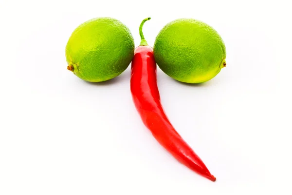 Limefrukterna och en paprika — Stockfoto