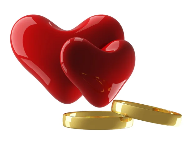 Dos corazones con anillos de boda — Foto de Stock
