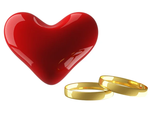 Coração com anéis de casamento — Fotografia de Stock