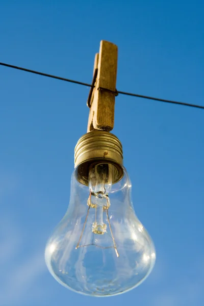 Bulb hanging on a clothespin — Stock Photo, Image