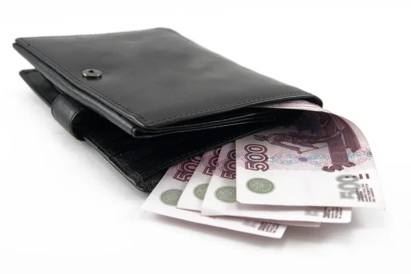 Dinheiro em uma bolsa em um fundo branco — Fotografia de Stock