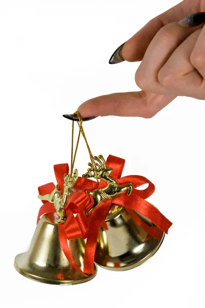 Two handbells hanging on a finger — Stock Photo, Image