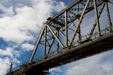 Railway bridge on a background of clouds clipart