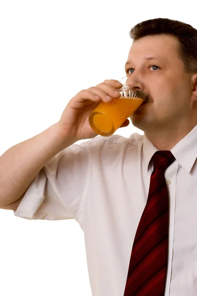 The young man drinking juice — Stock Photo, Image