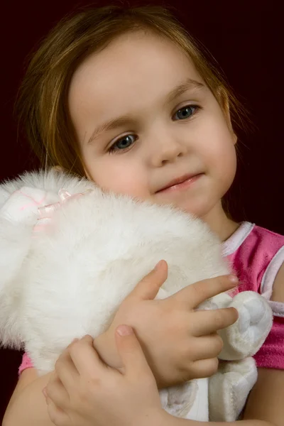 stock image Little girl embracing favourite toy