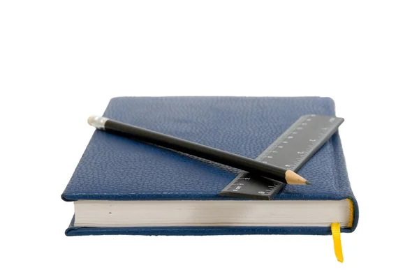 Caderno azul escuro em uma mesa — Fotografia de Stock