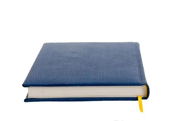 Caderno azul escuro em uma mesa — Fotografia de Stock