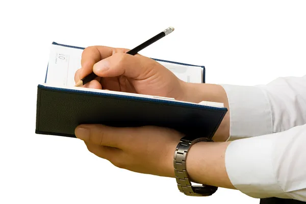 Écrire à la main sur un carnet. Gros plan . — Photo
