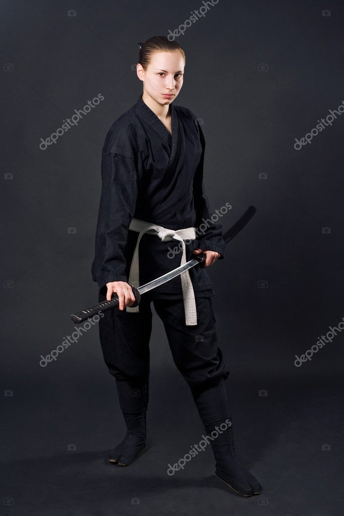 Ninja samurai holds katana in a hands Stock Photo