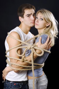 Frighten couple bound with ropes clipart