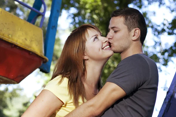 Kiss on the carousel — Stock Photo, Image