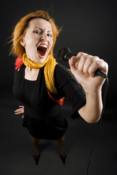 Woman with a microphone — Stock Photo, Image