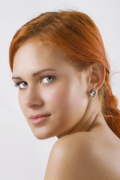 Woman looking over her shoulder — Stock Photo, Image