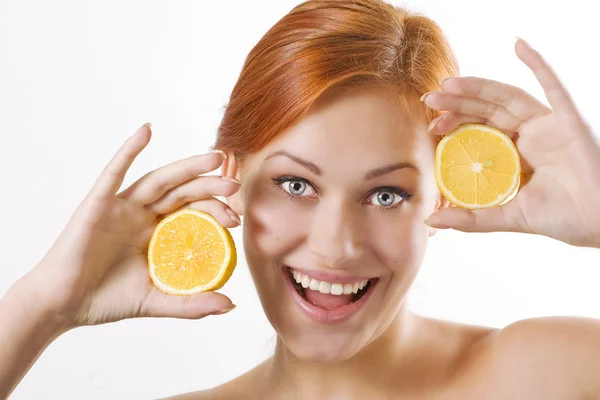 Beautiful girl with juicy lemons — Stock Photo, Image