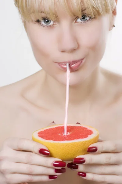 Beautiful woman drinking juice — Stock Photo, Image