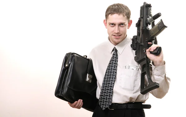 Young purposeful manager with gun — Stock Photo, Image