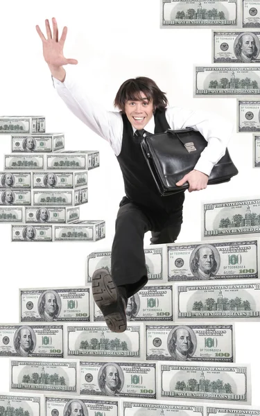Jonge zakenman springt door dollar — Stockfoto