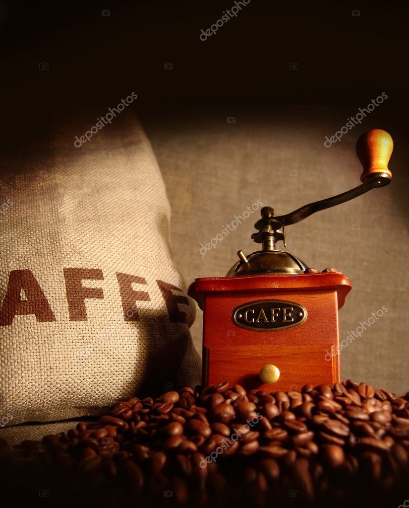 old coffee grinder with coffee beans
