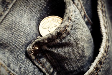 Jeans pockets with twenty cents coins clipart