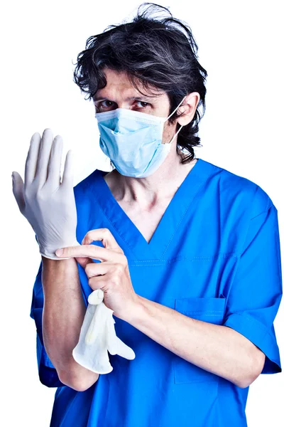 Surgeon struggle into gloves on hands — Stock Photo, Image